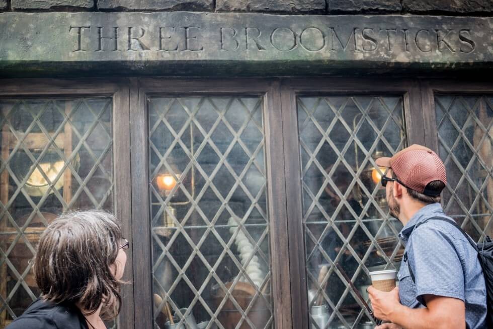 Watching the dishes being magically washed at The Three Broomsticks Visiting Harry Potter World Orlando