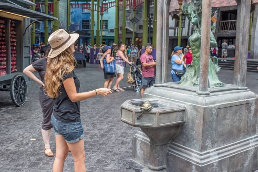 Casting a spell on the mermaid fountain Visiting Harry Potter World Orlando